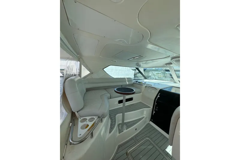 Slide: The Image of Interior of 2006 Tiara Yachts 4300 Sovran, featuring sleek seating and modern design. - 11