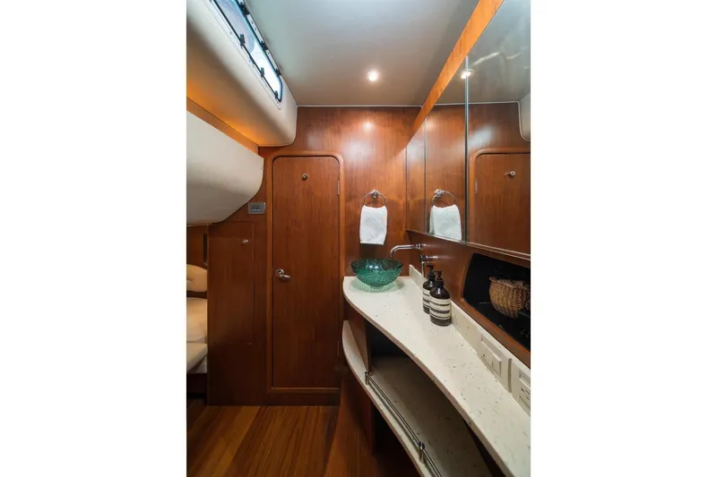 Slide: The Image of Luxurious 2006 Tiara Yachts 4300 Sovran bathroom with elegant wood finish and modern amenities. - 15