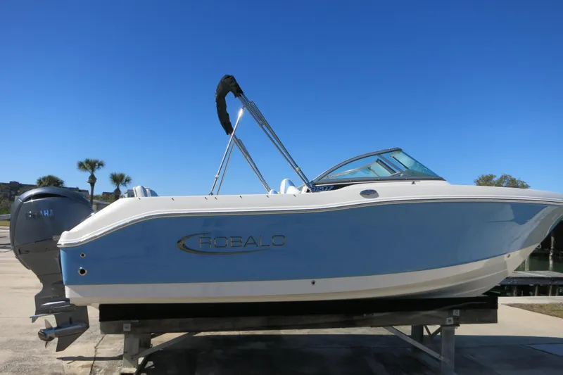 The Image of 2026 Robalo R207 Dual Console boat on display, featuring sleek design and Yamaha engine. - 0