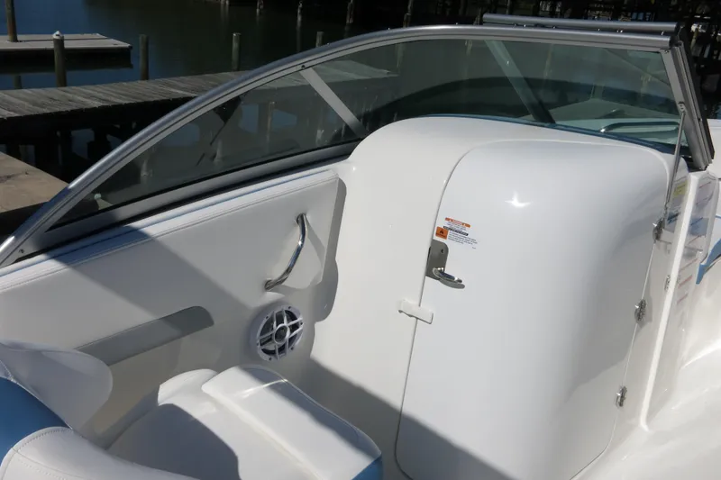 Slide: The Image of 2026 Robalo R207 Dual Console boat interior with seating and speaker detail. - 16