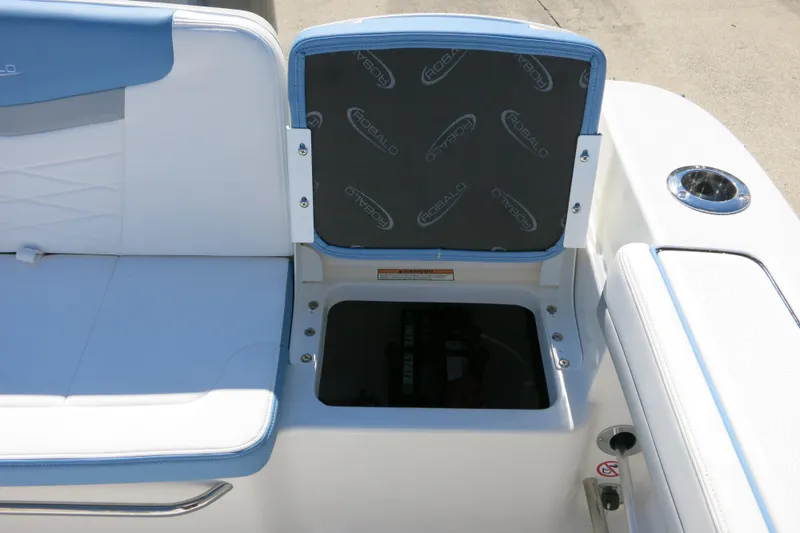Slide: The Image of 2026 Robalo R207 Dual Console boat seat with open storage compartment. - 20