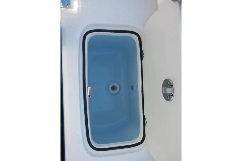 Slide: The Image of Livewell compartment on 2026 Robalo R207 Dual Console boat. - 22