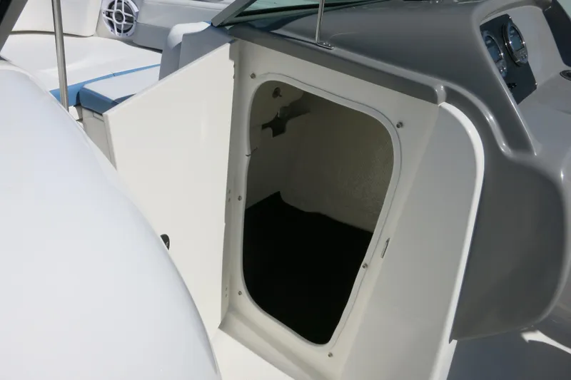 Slide: The Image of 2026 Robalo R207 Dual Console boat interior storage compartment. - 29