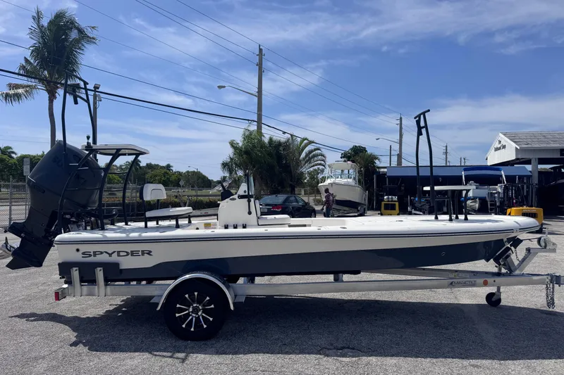 The Image of 2026 Spyder FX19 Vapor boat on trailer, parked outdoors under clear sky. - 0