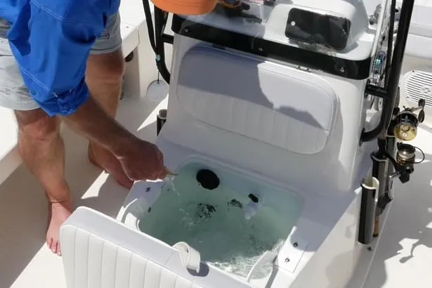 Slide: The Image of 2026 Spyder FX19 Vapor boat with sleek design and modern features, docked outdoors. - 11