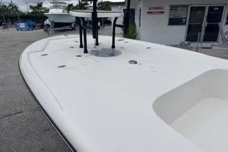 Slide: The Image of 2026 Spyder FX19 Vapor boat docked, showcasing sleek design and spacious deck. - 16