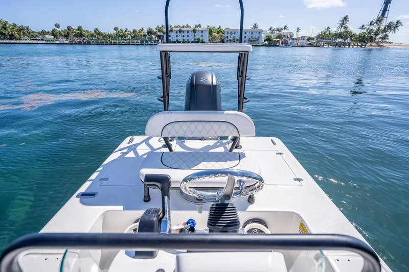 Slide: The Image of 2026 Spyder FX19 Vapor boat on calm water, featuring sleek design and modern controls. - 20