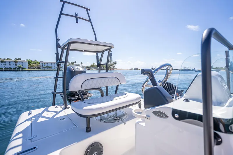 Slide: The Image of 2026 Spyder FX19 Vapor boat on calm water, featuring sleek design and modern controls. - 22