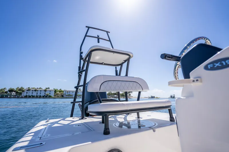 Slide: The Image of 2026 Spyder FX19 Vapor boat on water, featuring sleek seating and modern design. - 23