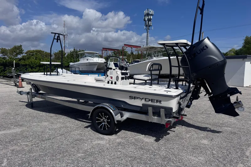 Slide: The Image of 2026 Spyder FX19 Vapor boat on trailer, featuring Suzuki outboard motor. - 3