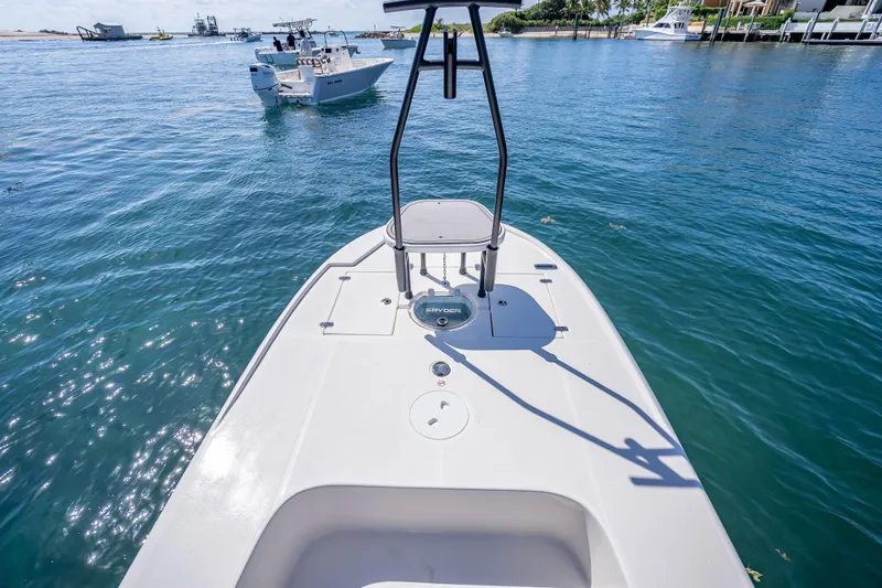 Slide: The Image of 2026 Spyder FX19 Vapor boat on calm water, showcasing sleek deck design. - 35