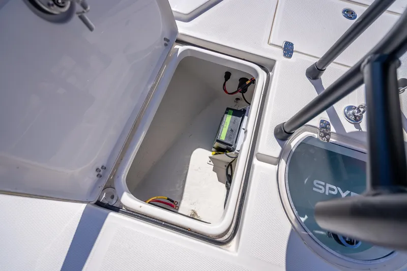 Slide: The Image of Open storage compartment on 2026 Spyder FX19 Vapor boat deck. - 44