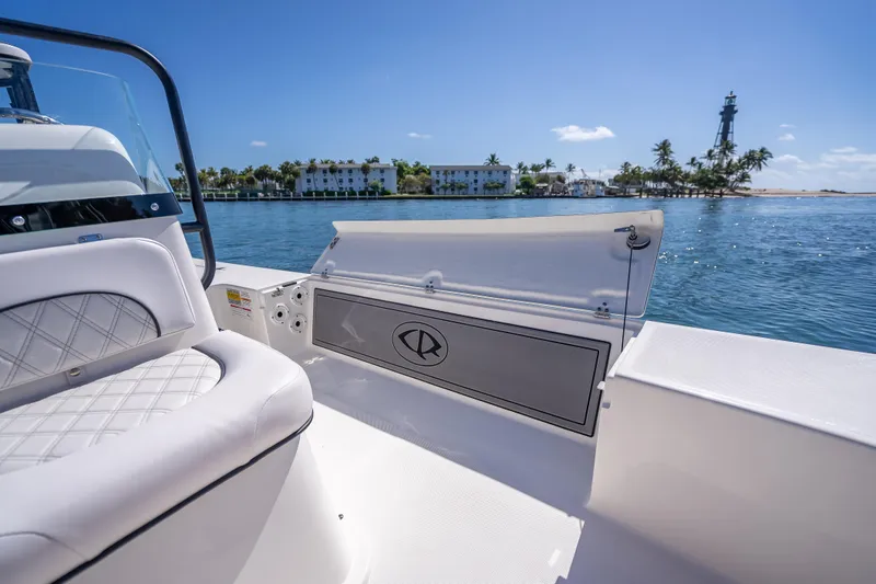 Slide: The Image of 2026 Spyder FX19 Vapor boat interior with ocean view and distant lighthouse. - 45