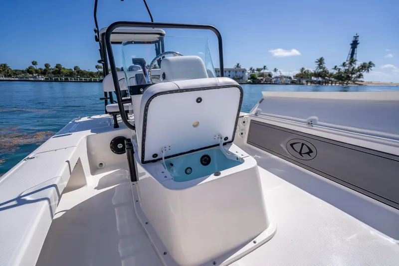 Slide: The Image of 2026 Spyder FX19 Vapor boat interior with open storage, ocean view, and clear sky. - 46
