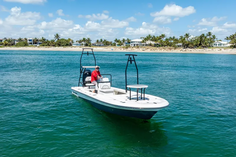 Slide: The Image of 2026 Spyder FX19 Vapor boat with sleek design and modern features, docked outdoors. - 47