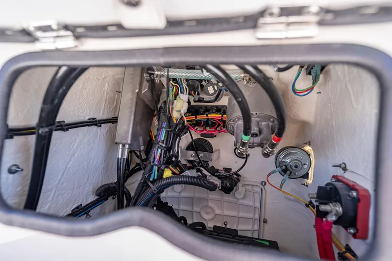 Slide: The Image of Engine compartment of 2026 Spyder FX19 Vapor, showcasing wiring and mechanical components. - 51