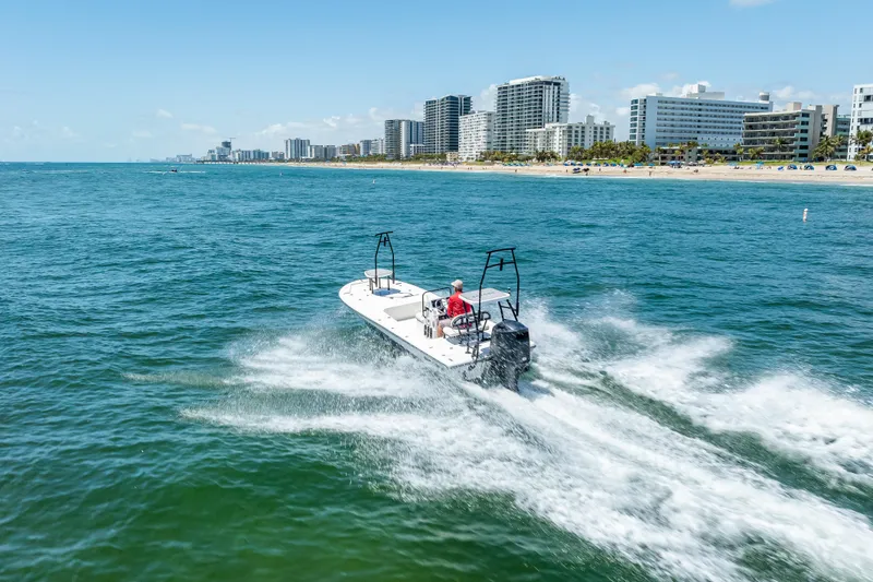 Slide: The Image of 2026 Spyder FX19 Vapor boat on trailer in sunny outdoor setting. - 52