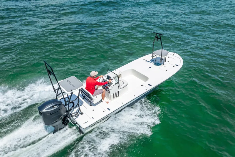 Slide: The Image of 2026 Spyder FX19 Vapor boat on trailer in sunny outdoor setting. - 53