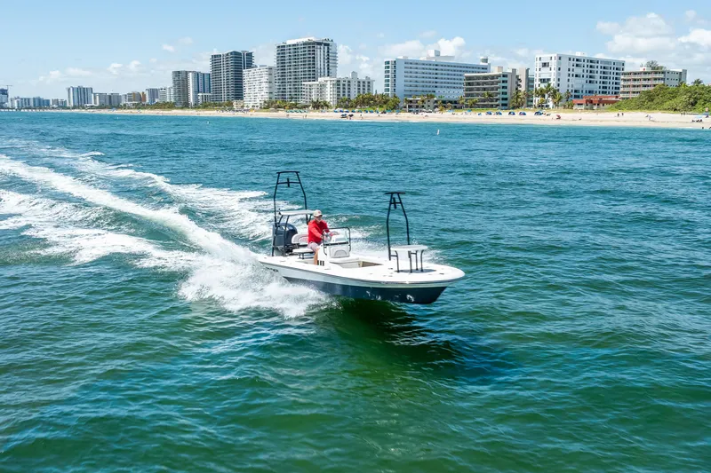 Slide: The Image of 2026 Spyder FX19 Vapor boat on trailer, showcasing engine and rear details. - 57