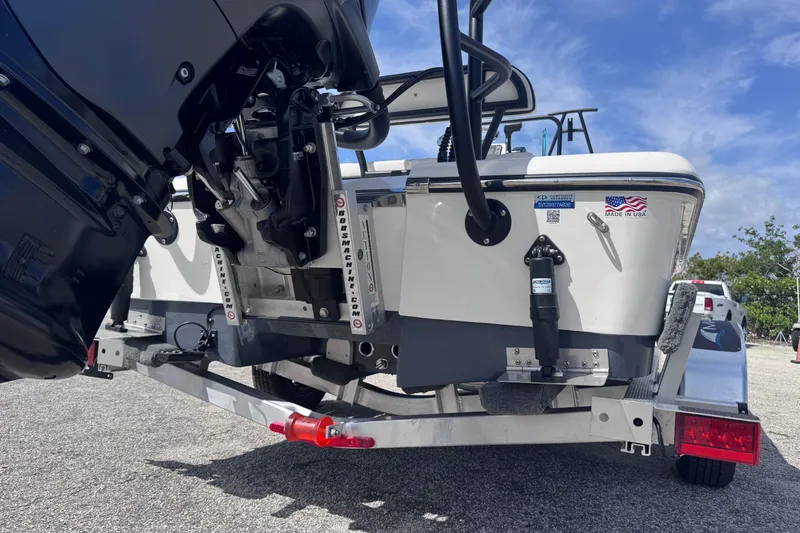 Slide: The Image of 2026 Spyder FX19 Vapor boat on trailer, showcasing engine and rear details. - 7