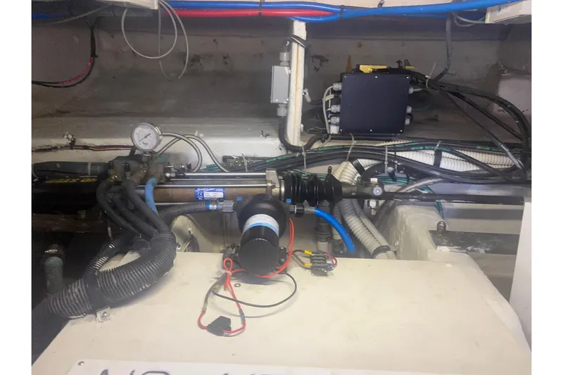 Slide: The Image of Engine room of 2006 Sea Ray 52 Sedan Bridge with visible wiring and components. - 46