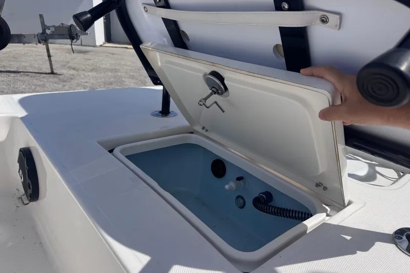 Slide: The Image of Open storage compartment on 2026 Spyder FX17 Flicker boat, showcasing interior features. - 12
