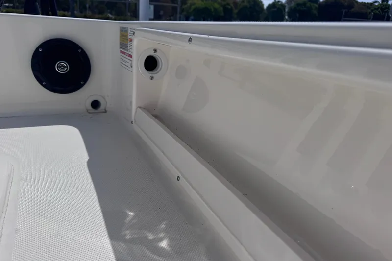 Slide: The Image of Interior view of 2026 Spyder FX17 Flicker boat, featuring speaker and storage compartment. - 16