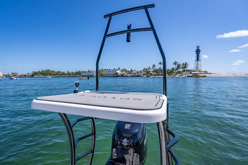 Slide: The Image of Spyder FX17 Flicker 2026 boat on water near lighthouse and palm trees. - 18