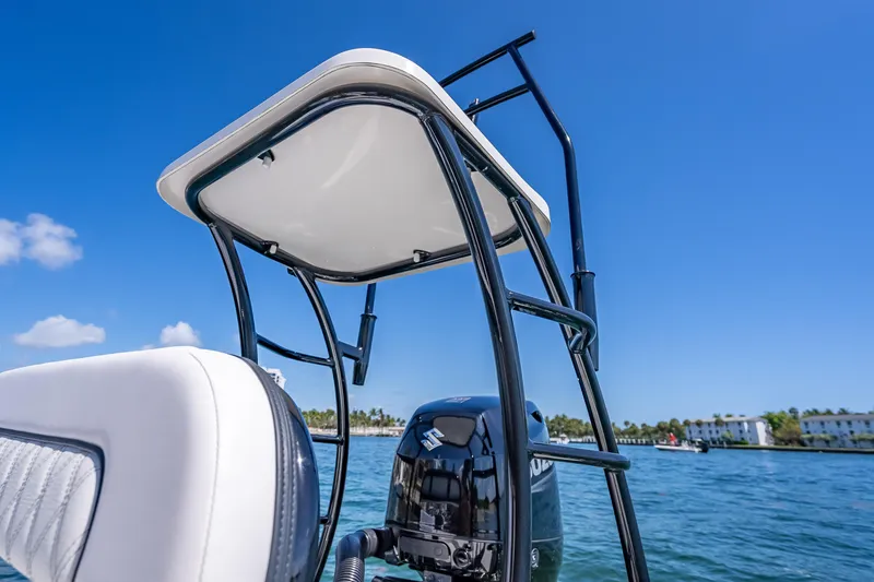 Slide: The Image of 2026 Spyder FX17 Flicker boat with T-top on a sunny day. - 19