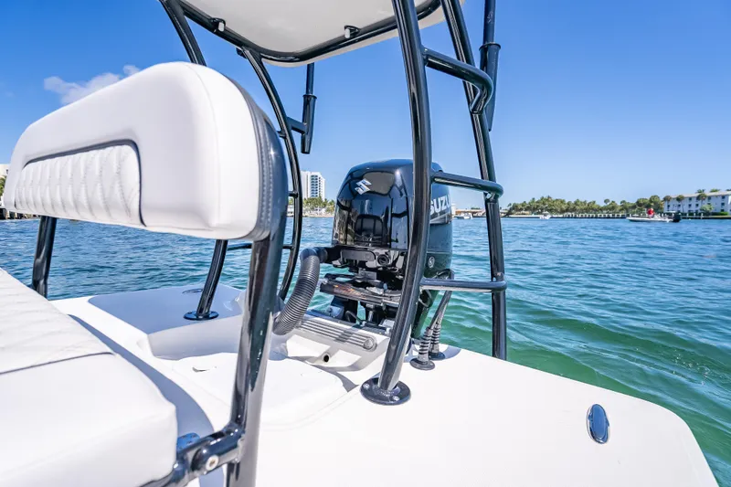 Slide: The Image of 2026 Spyder FX17 Flicker boat on water, featuring Suzuki outboard motor. - 20