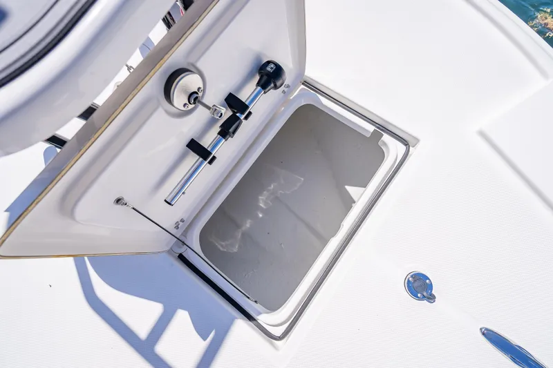 Slide: The Image of Open storage compartment on 2026 Spyder FX17 Flicker boat deck. - 23