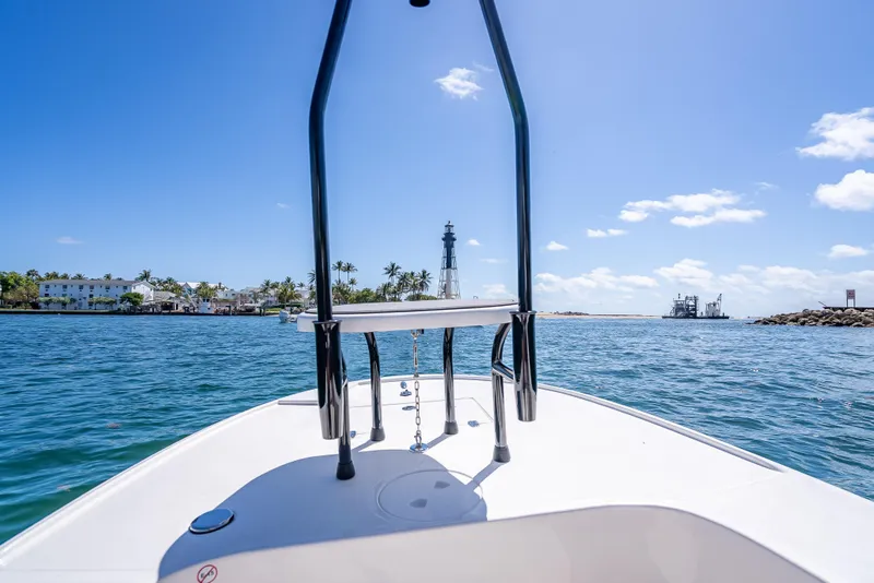 Slide: The Image of Boat view from Spyder FX17 Flicker 2026, approaching lighthouse on sunny day. - 24