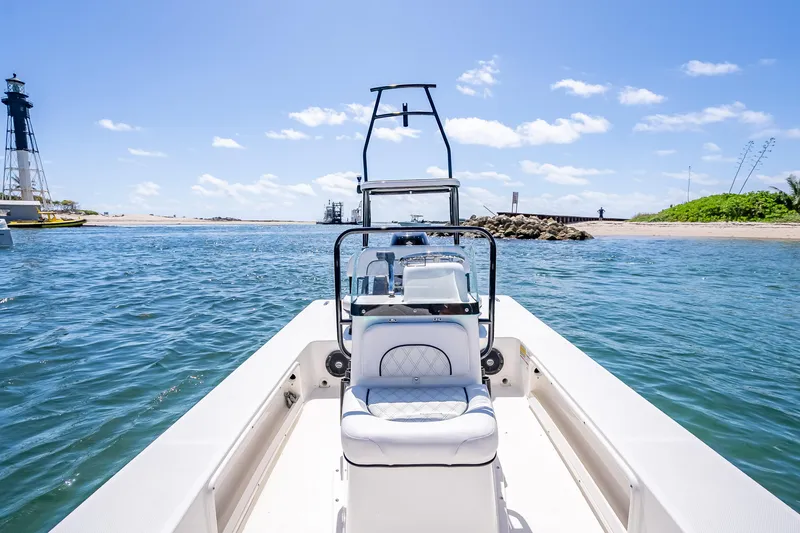 Slide: The Image of 2026 Spyder FX17 Flicker boat on water near lighthouse and shoreline. - 26