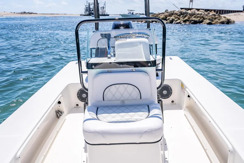Slide: The Image of 2026 Spyder FX17 Flicker boat interior with white seating, on a sunny day at sea. - 27