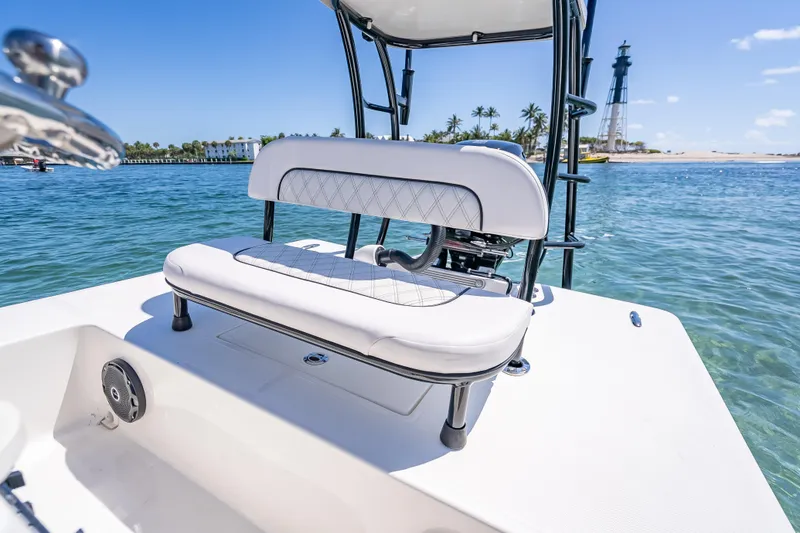 Slide: The Image of 2026 Spyder FX17 Flicker boat with white seating, ocean view, and distant lighthouse. - 34
