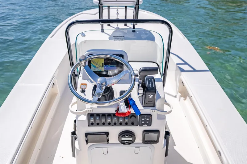 Slide: The Image of 2026 Spyder FX17 Flicker boat console with steering wheel and controls on water. - 38