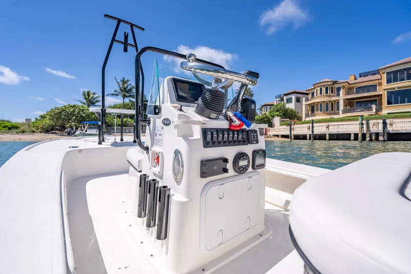 Slide: The Image of 2026 Spyder FX17 Flicker boat interior with control panel, dockside view, luxury waterfront homes. - 39