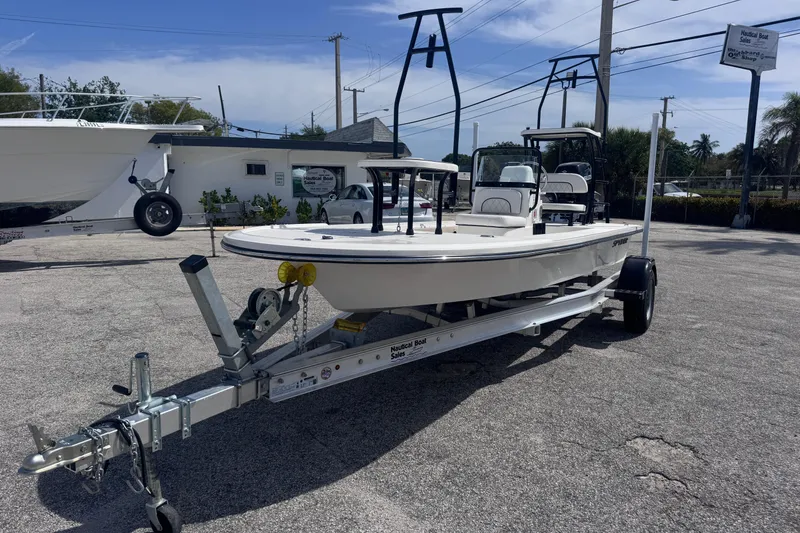 Slide: The Image of 2026 Spyder FX17 Flicker boat on trailer in sunny outdoor setting. - 4