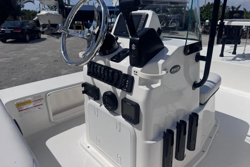 Slide: The Image of 2026 Spyder FX17 Flicker boat console with steering wheel and controls. - 9