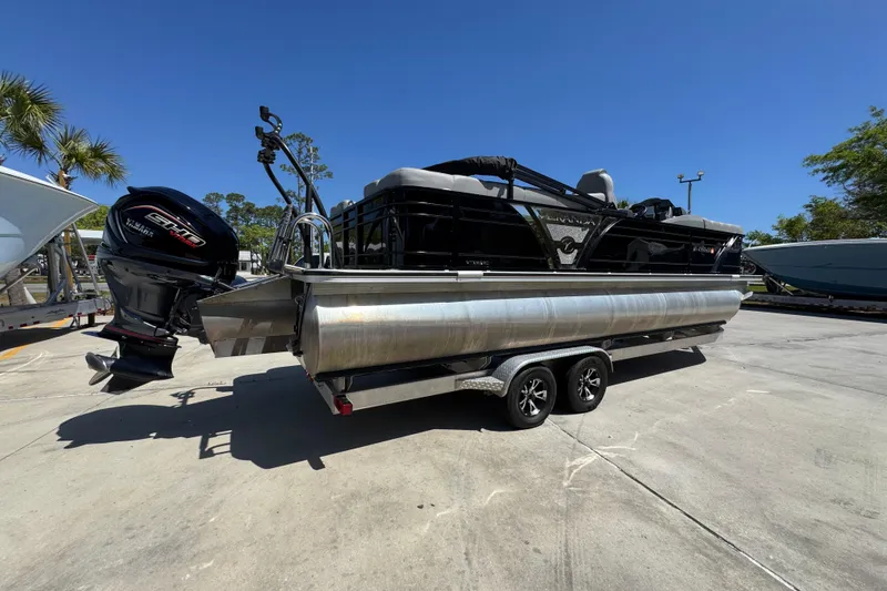 Slide: The Image of 2023 Veranda VTX 25RC pontoon boat with outboard motor on trailer. - 11