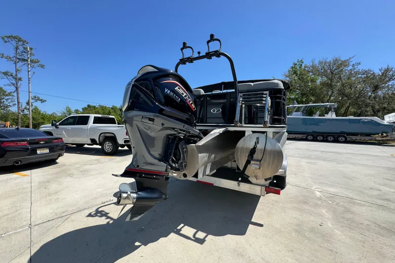 Slide: The Image of 2023 Veranda VTX 25RC pontoon boat with Yamaha engine in a parking lot. - 13