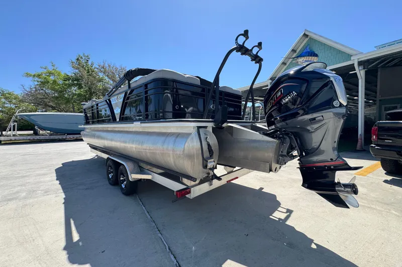 Slide: The Image of 2023 Veranda VTX 25RC pontoon boat with Yamaha outboard motor on trailer. - 16