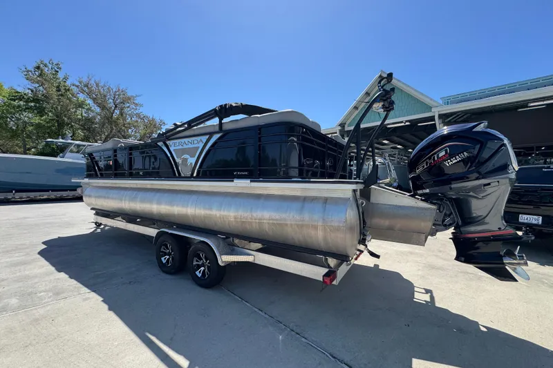 Slide: The Image of 2023 Veranda VTX 25RC pontoon boat on trailer with Yamaha outboard motor. - 17