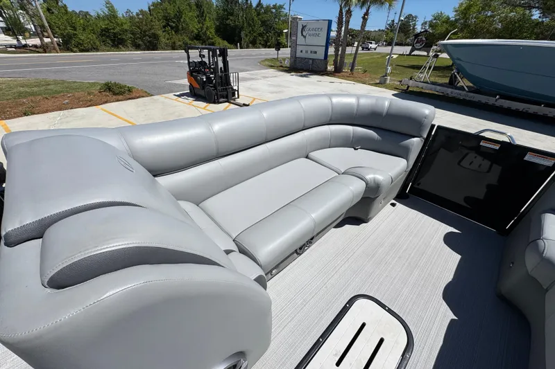 Slide: The Image of 2023 Veranda VTX 25RC pontoon boat with luxurious gray seating and spacious deck. - 19