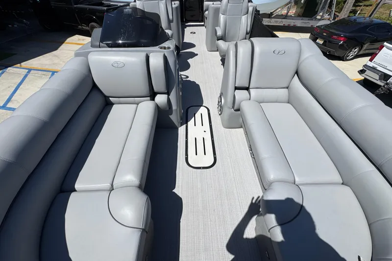 Slide: The Image of 2023 Veranda VTX 25RC pontoon boat with luxurious gray seating and spacious layout. - 21