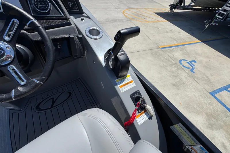 Slide: The Image of 2023 Veranda VTX 25RC boat cockpit with steering wheel and throttle controls. - 28