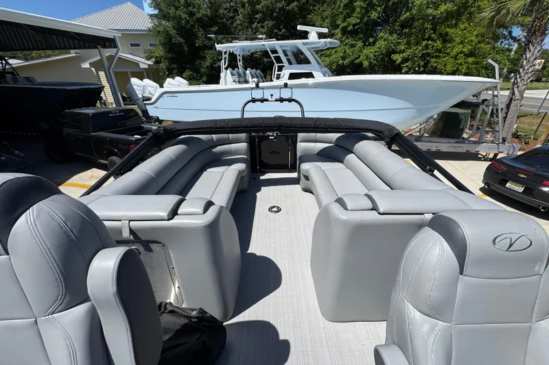 Slide: The Image of 2023 Veranda VTX 25RC pontoon boat with luxurious gray seating and spacious deck layout. - 30