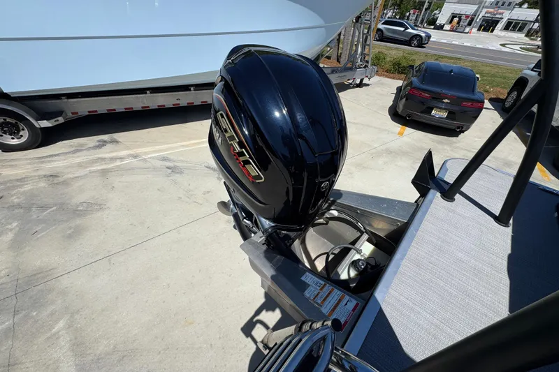 Slide: The Image of 2023 Veranda VTX 25RC boat with powerful outboard motor in a parking lot. - 36