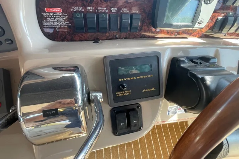 Slide: The Image of Cockpit of 2006 Sea Ray 360 Sundancer with navigation instruments and steering wheel. - 13