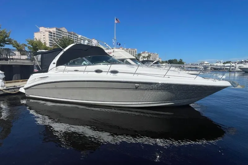 Slide: The Image of 2006 Sea Ray 360 Sundancer docked at marina with American flag. - 2